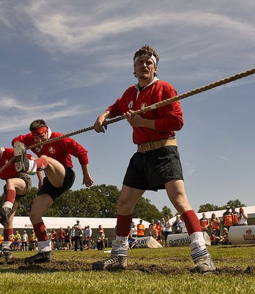 Photo of men holding rope