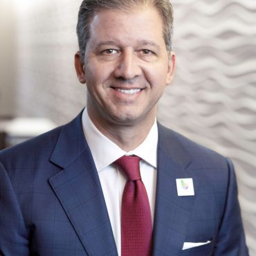 Photo of man smiling at camera