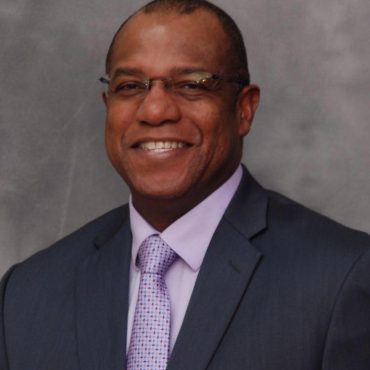 Photo of man smiling at camera