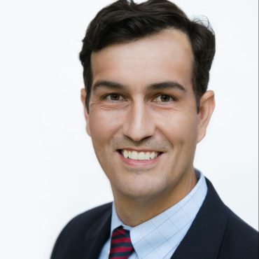 Photo of man smiling at camera