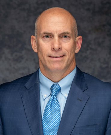 Photo of man smiling at camera