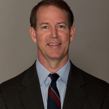 Photo of man smiling at camera