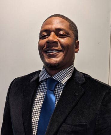 Photo of man smiling at camera