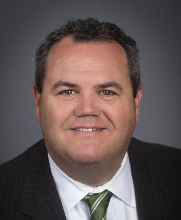 Photo of man smiling at camera