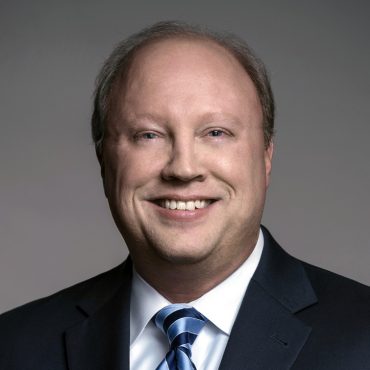 Photo of man smiling at camera