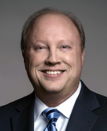 Photo of man smiling at camera