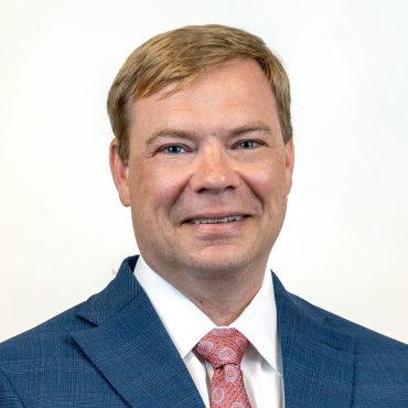Photo of man smiling at camera