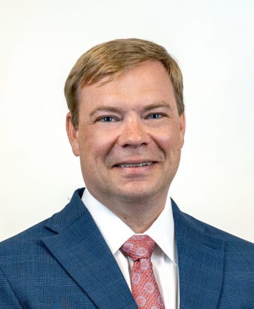 Photo of man smiling at camera