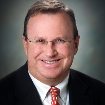 Photo of man smiling at camera