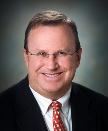 Photo of man smiling at camera