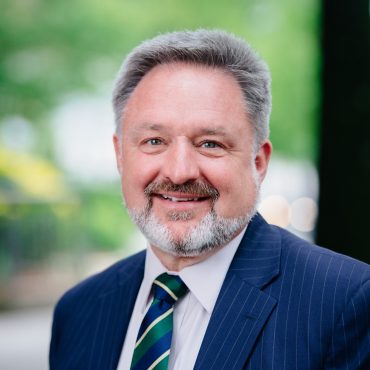 Photo of man smiling at camera