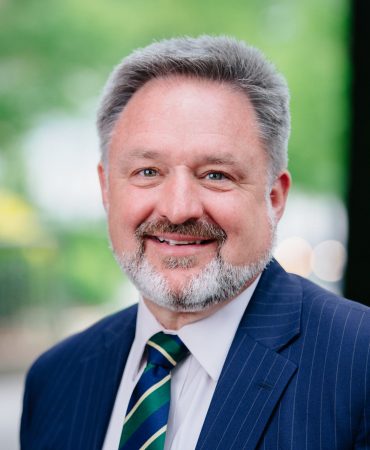Photo of man smiling at camera