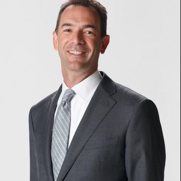Photo of man smiling at camera