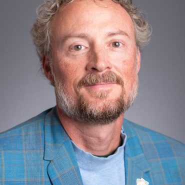 Photo of man smiling at camera