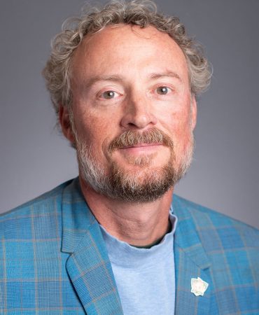 Photo of man smiling at camera