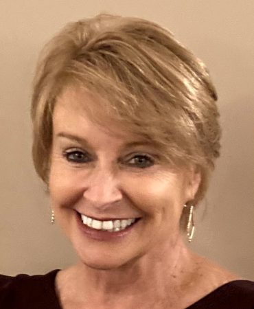 Photo of woman smiling at camera